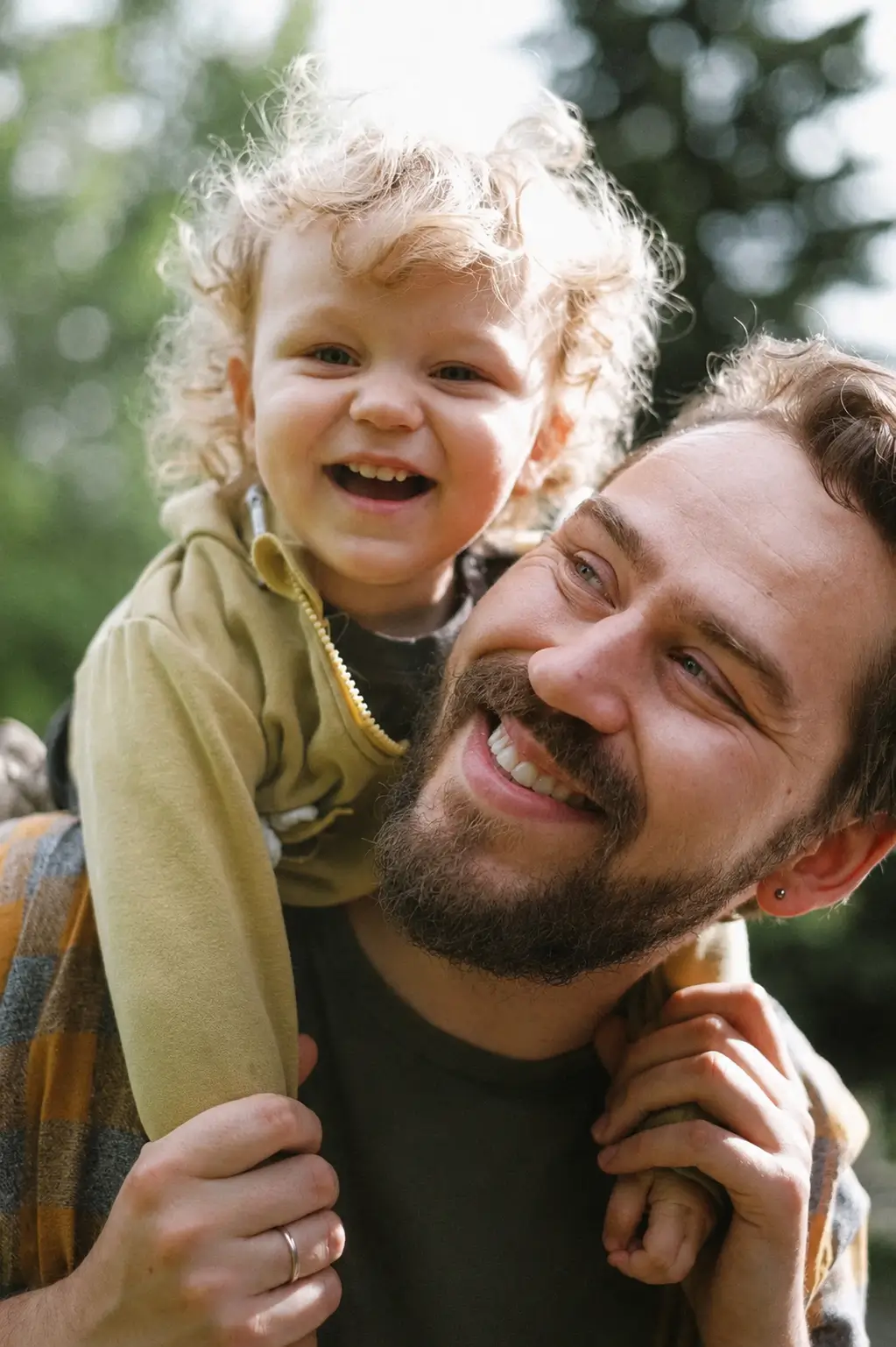 Isaac smiling with his dad